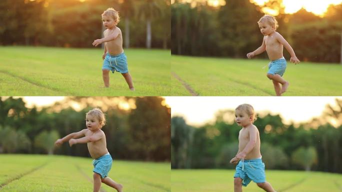 婴儿宝宝起床，在外面的花园草坪上奔跑。3岁小男孩在理想的黄金时间里奔跑的自然瞬间，超慢镜头120帧/