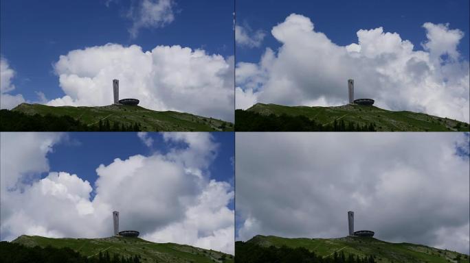 在山峰上的纪念碑上移动云层的时间流逝。