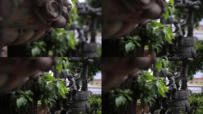 喷泉。花园雕像复古特写。布宜诺斯艾利斯拉雷科莱塔公墓的睡天使。花园雕塑。丘比特雕塑。布拉格公墓的天使