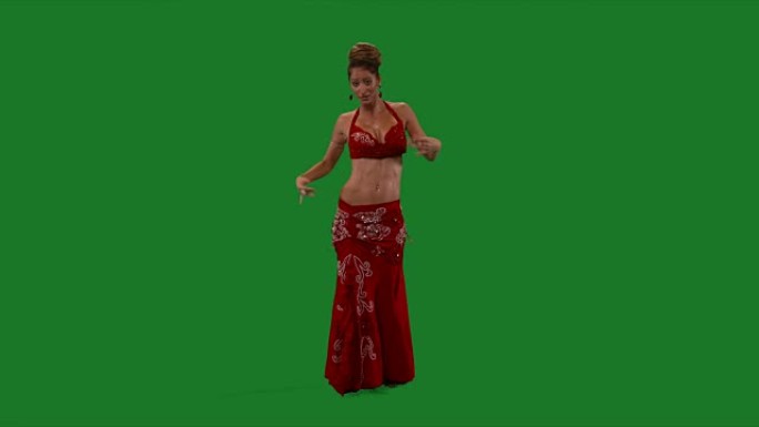 舞者。肚皮舞。肚皮舞者跳舞。绿色的屏幕。性感的红裙子