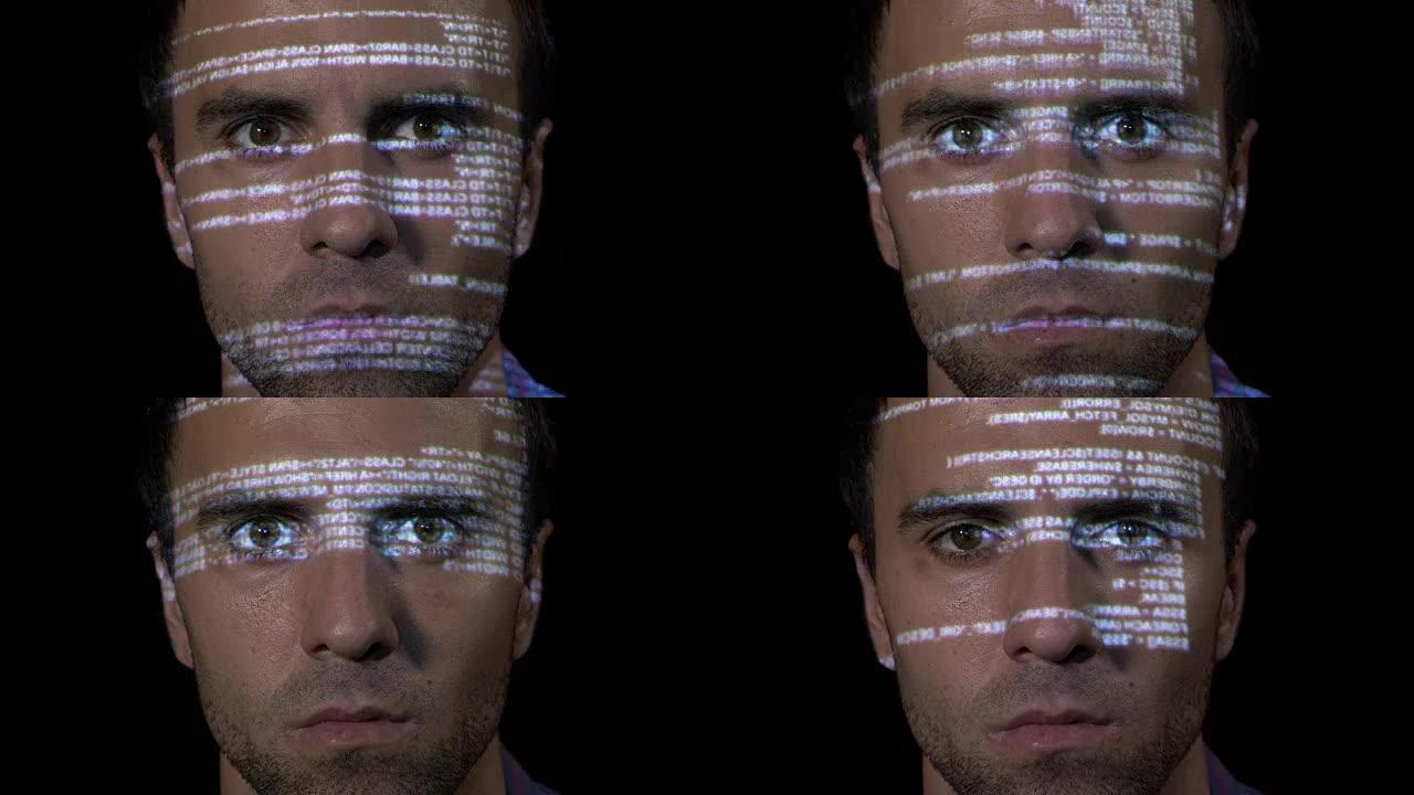 一位年轻的IT程序员网络工作者男性在反病毒程序上工作的肖像，而代码被投射在他的脸上