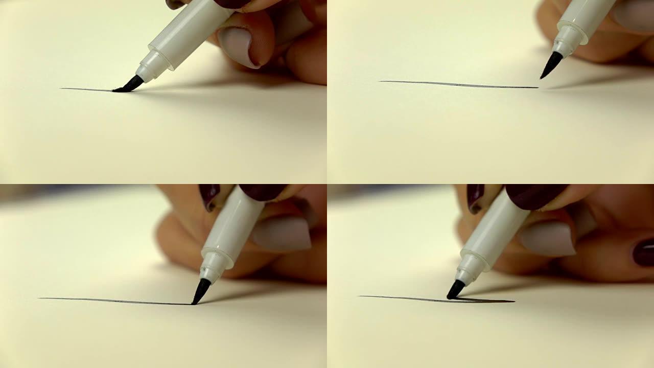 慢镜头。艺术家女孩手绘黑线画笔。特写