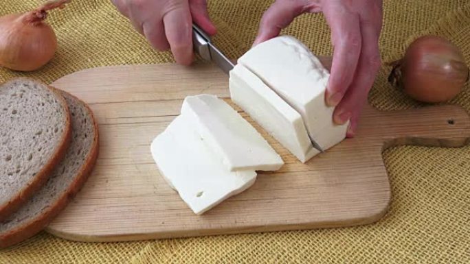 Healthy food. Goat cheese on a wooden cutting boar
