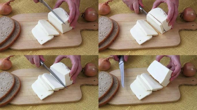 Healthy food. Goat cheese on a wooden cutting boar