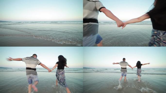 夫妻两人牵手跑向海边