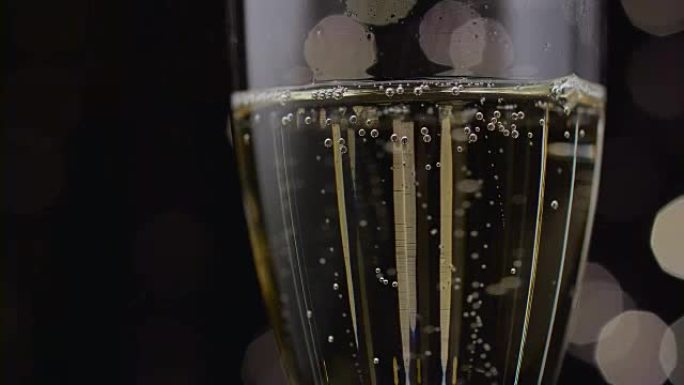 Close up of a glass of champagne. Bokeh background