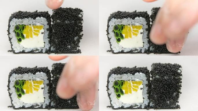 黑色鱼子酱精致面包卷厨师展示豪华日本餐厅寿司卷旋转白色