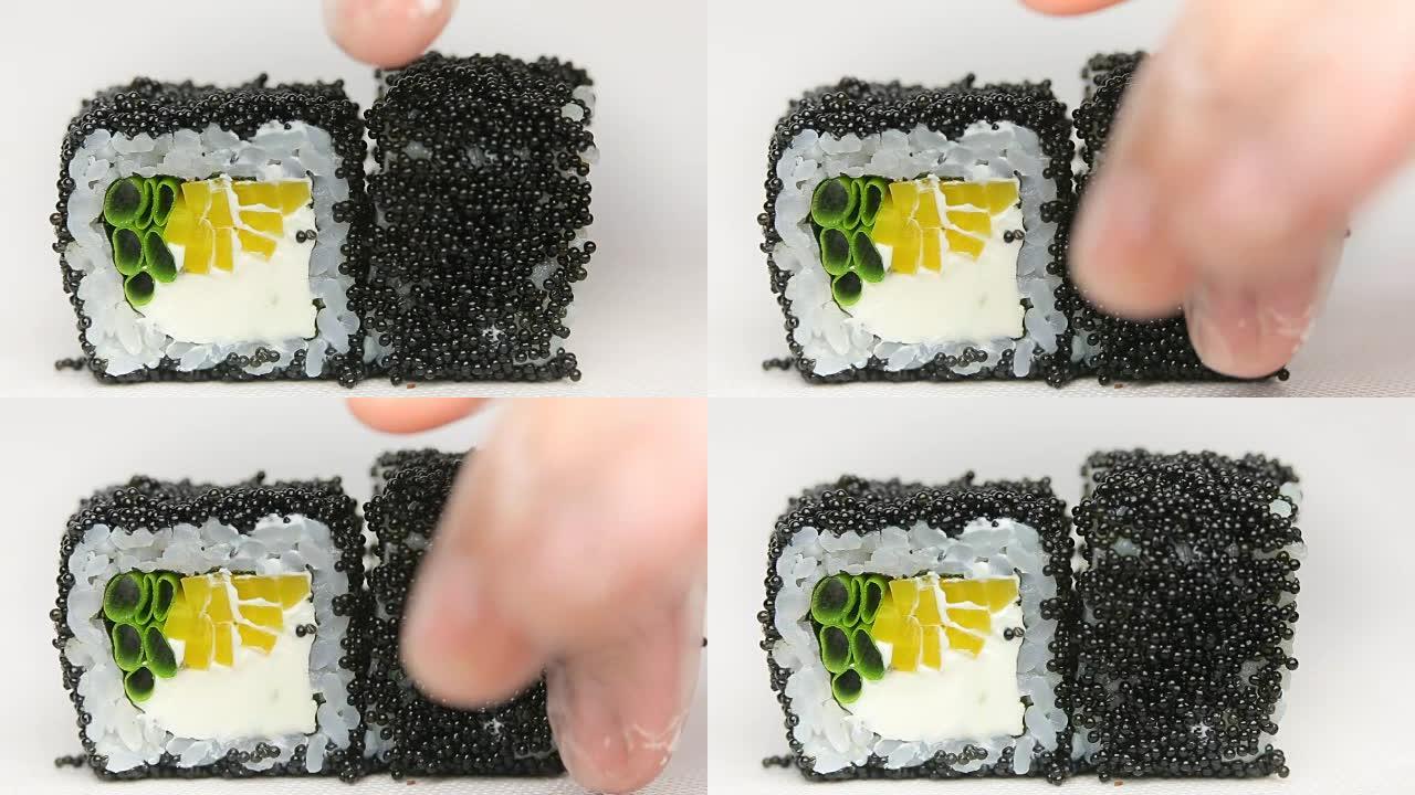黑色鱼子酱精致面包卷厨师展示豪华日本餐厅寿司卷旋转白色