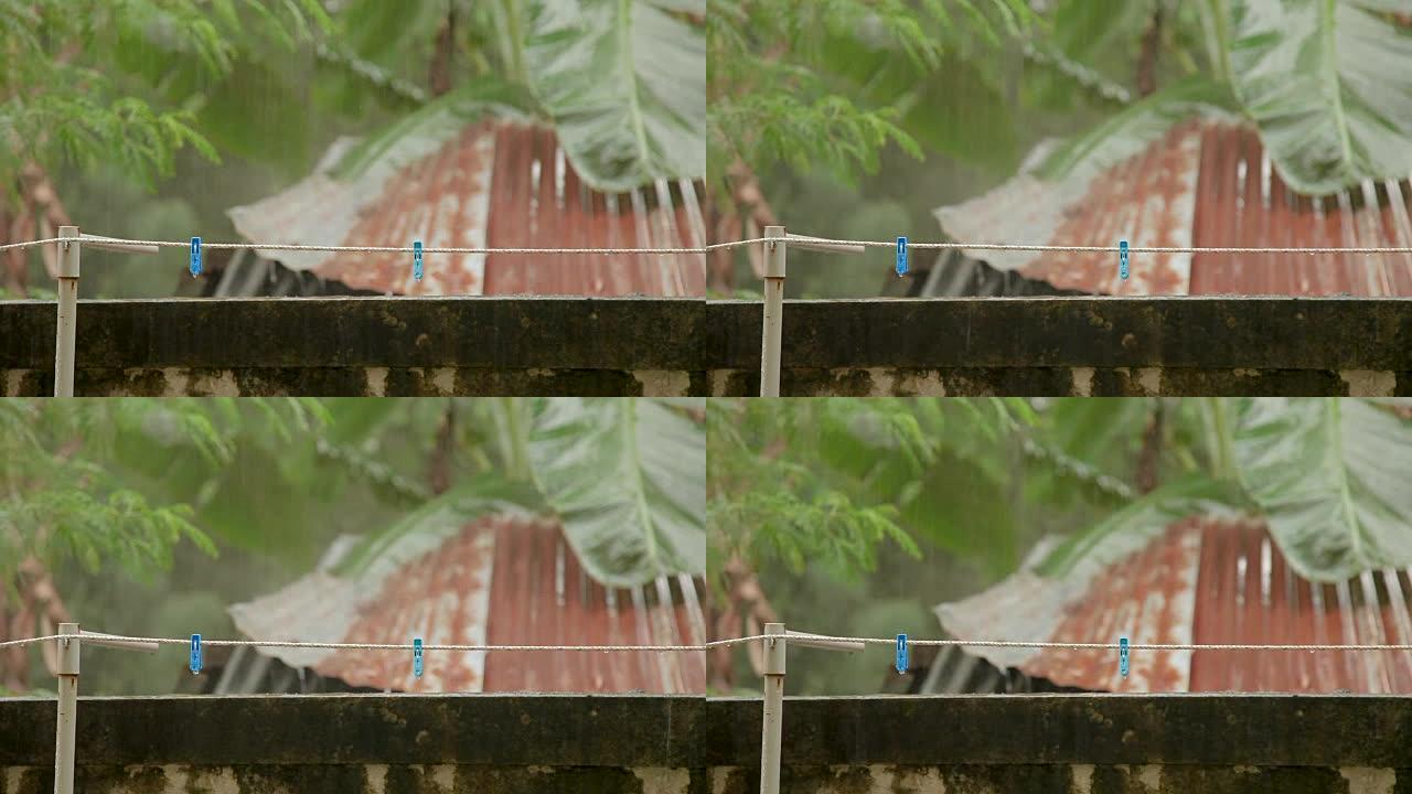 大雨下用衣夹绳子。泰国普吉岛