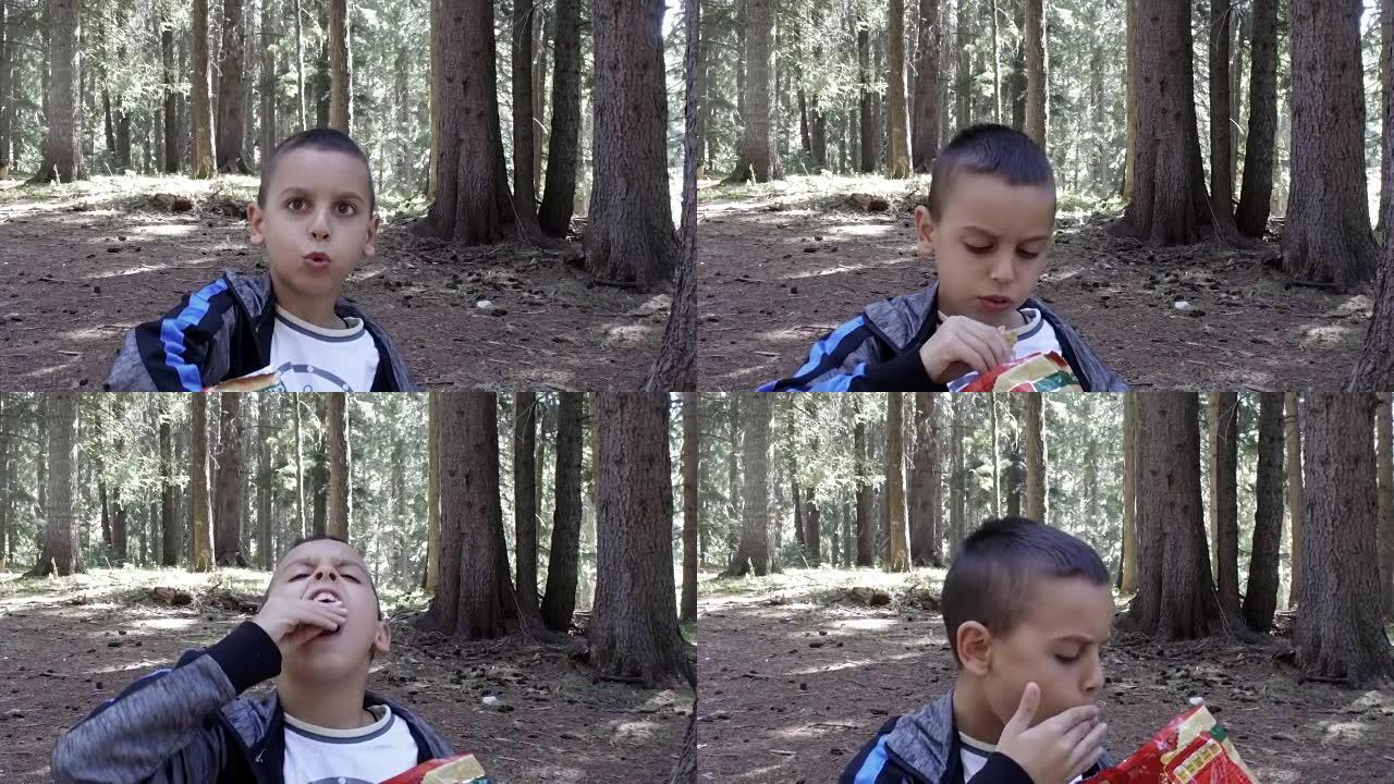 饥饿的小男孩张大嘴吃了一口美味的巴托薯片，慢动作