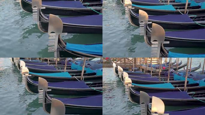 意大利威尼斯运河中的黑色吊船尖