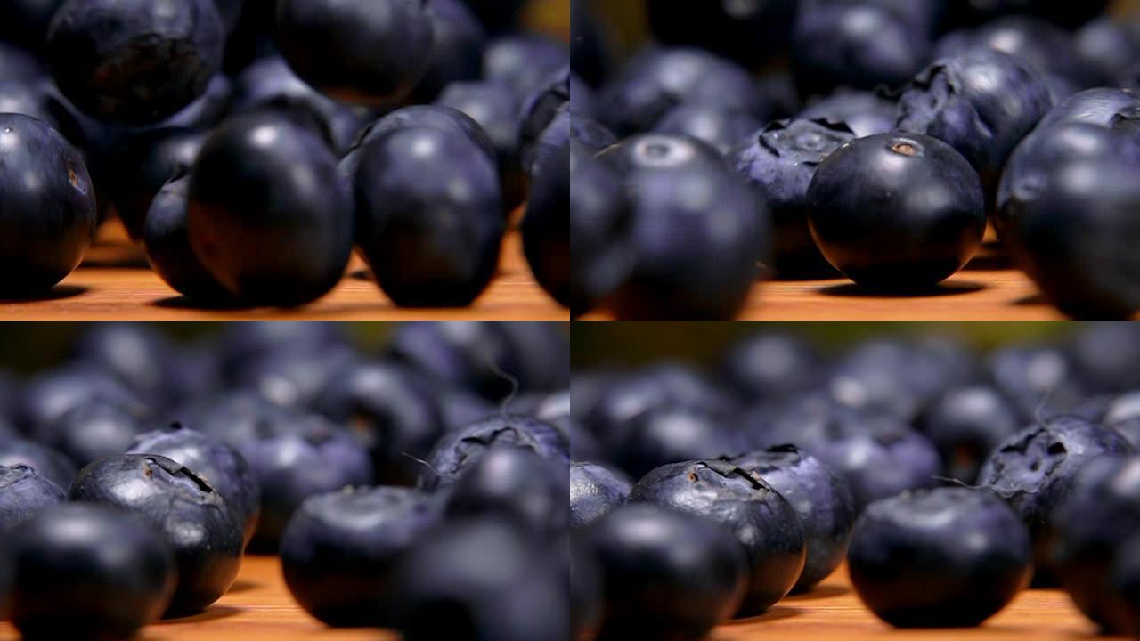 蓝莓在木桌上滚动特写