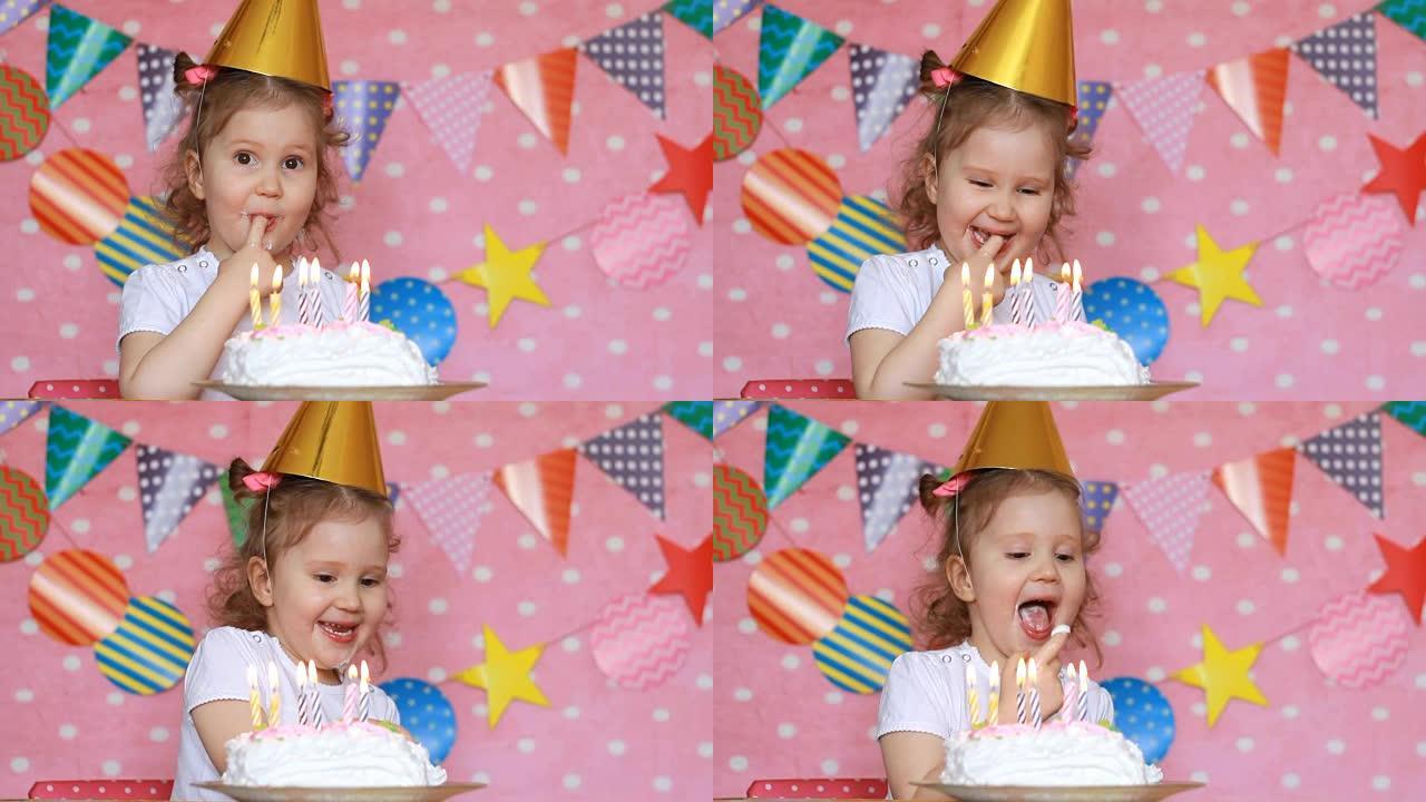 生日快乐。一个可爱的小女孩吃蛋糕，舔她的手指。
