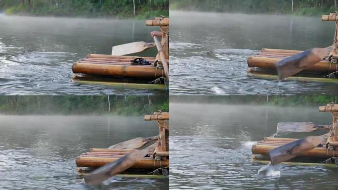 泰国湄宏顺庞雄早上在湖上漂浮的竹筏上的木船桨的特写镜头