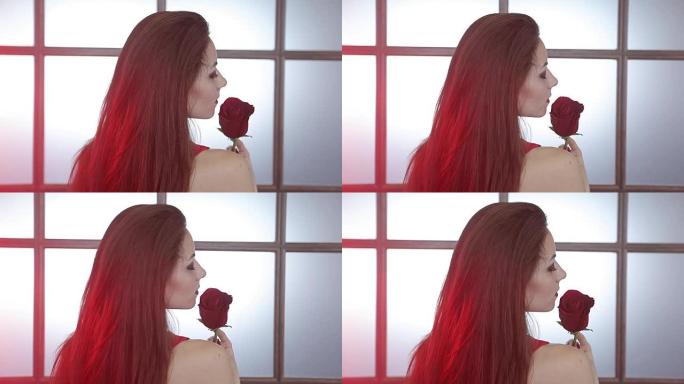 红玫瑰的黑发女孩。头发上的红灯。