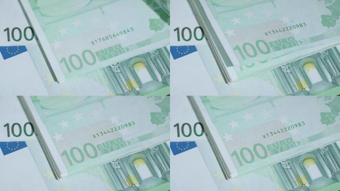 桌子上堆着一百欧元的钞票
