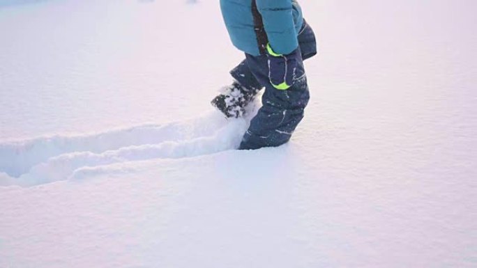 feet closeup coming through deep snow. Walk in the