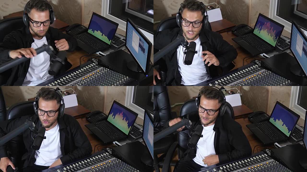 耳机里的DJ坐在调音台旁边，在背景电脑屏幕上对着迈克说