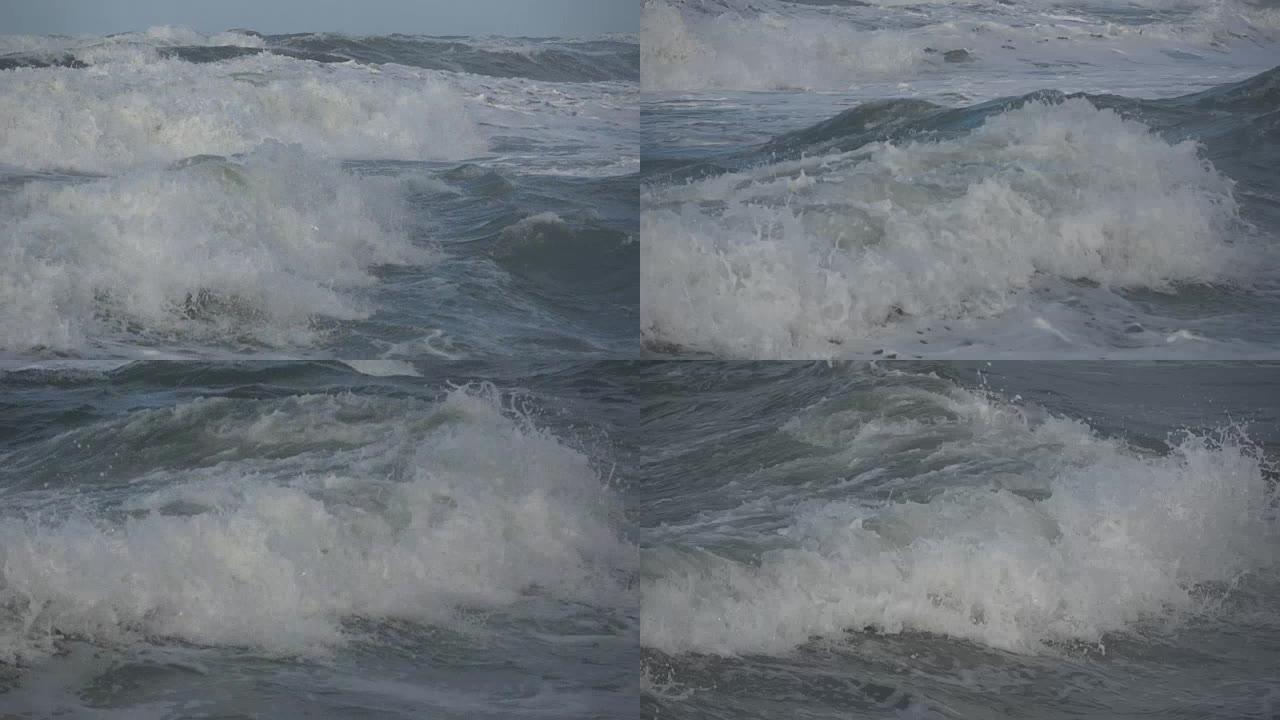 海浪在海滩上滚动是暴风雨的一天，冬天是地中海。意大利拉齐奥福芬。慢动作