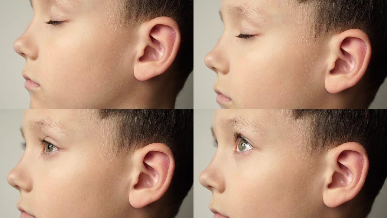 孩子脸的左侧。耳朵是特写的。