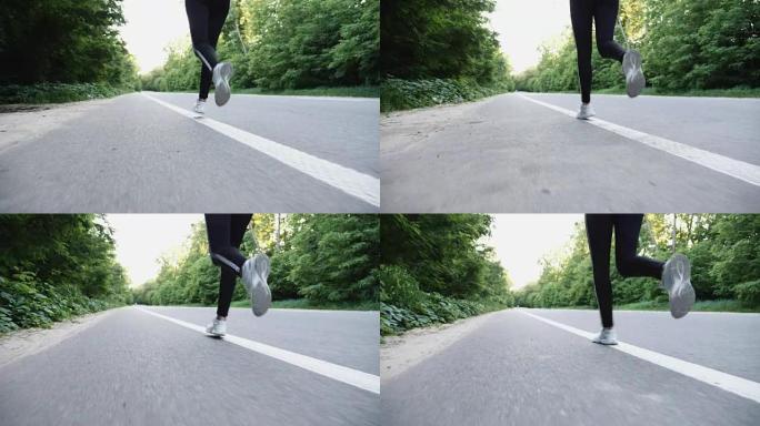 在乡村开阔的道路上奔跑的女跑步者