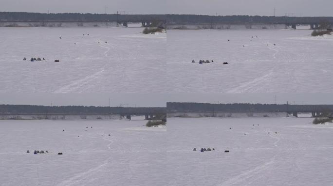 空中，冬季冰冻湖面上的团体渔民