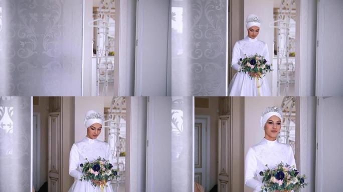 美丽的穆斯林新娘，穿着漂亮的婚纱化妆