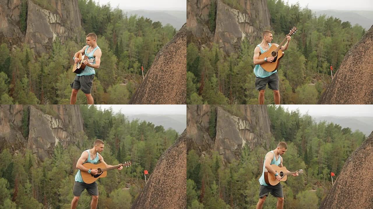 一个站在山顶上弹吉他的人。