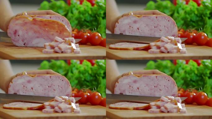 Chef cutting ham with knife on wood board