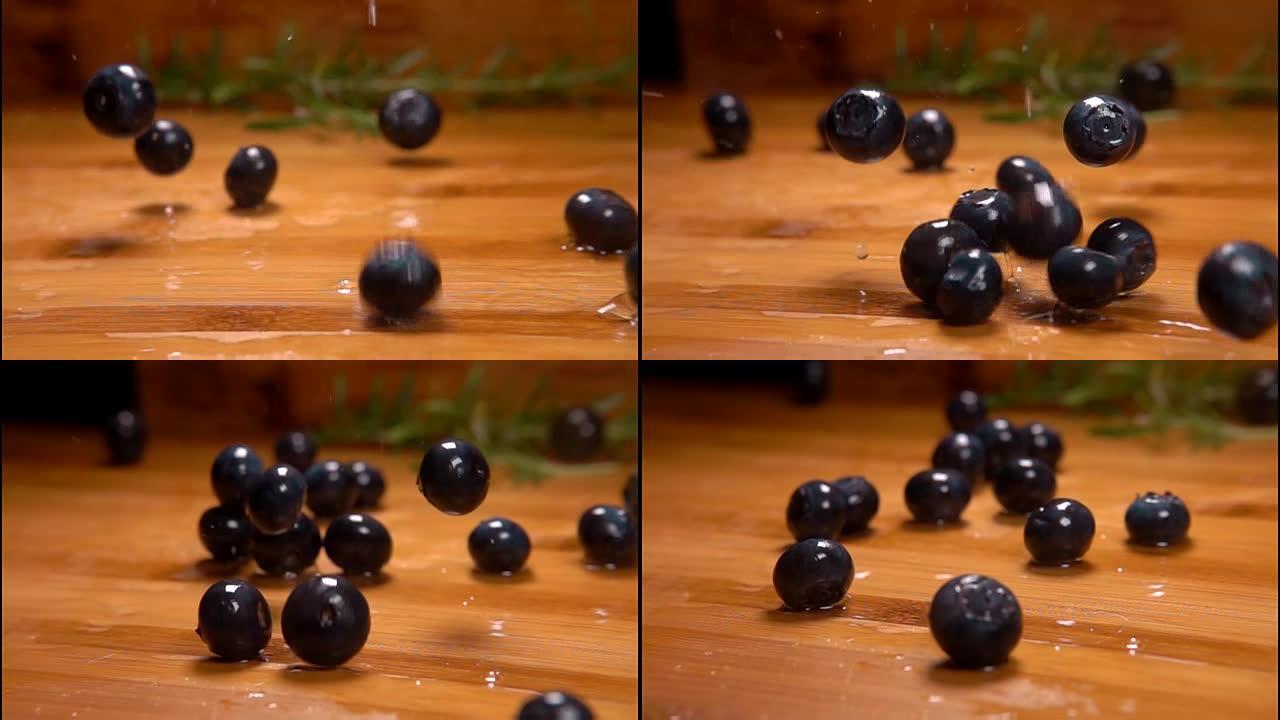 湿蓝莓落在木桌上滚动