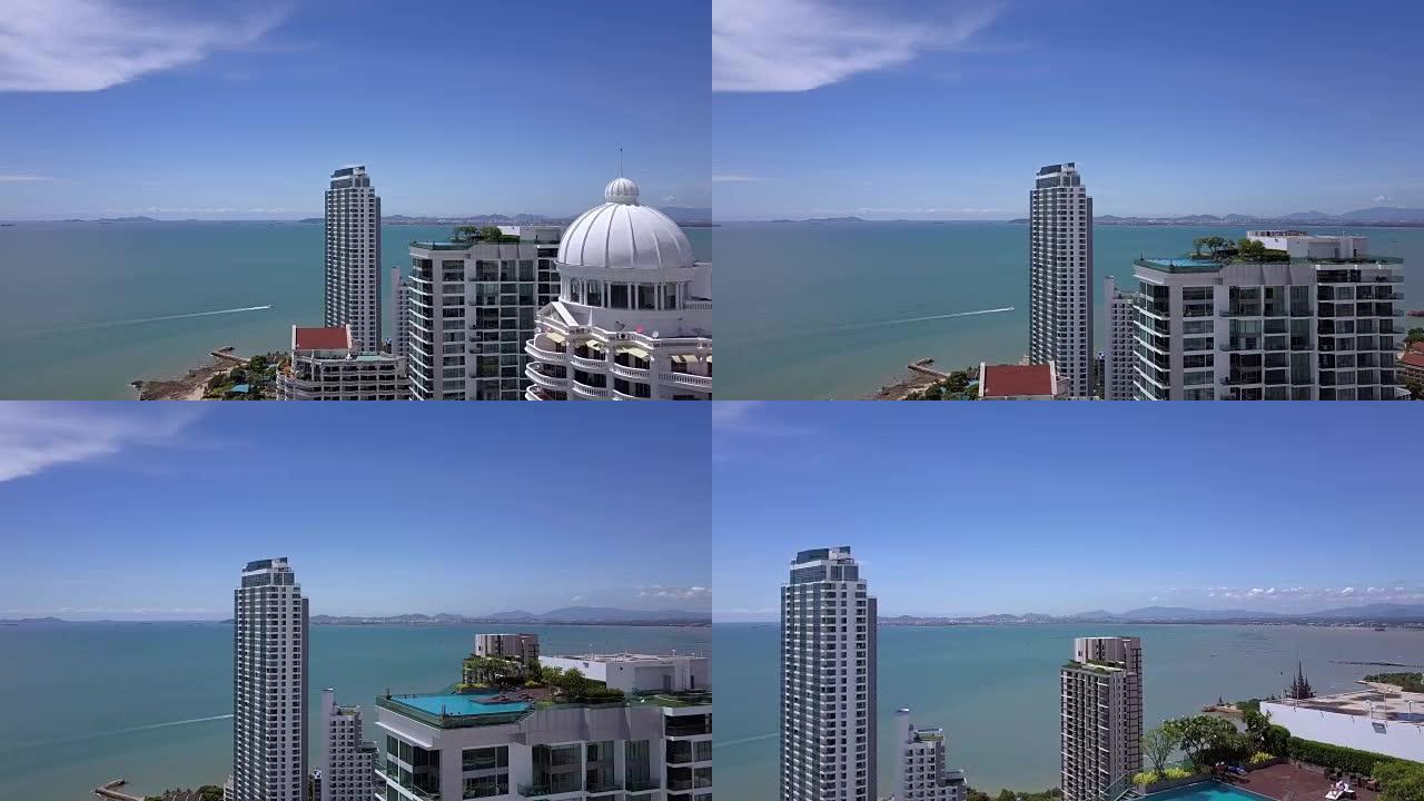 鸟瞰图全景海景。摩天大楼屋顶上的游泳池。海洋海滩上的公寓。