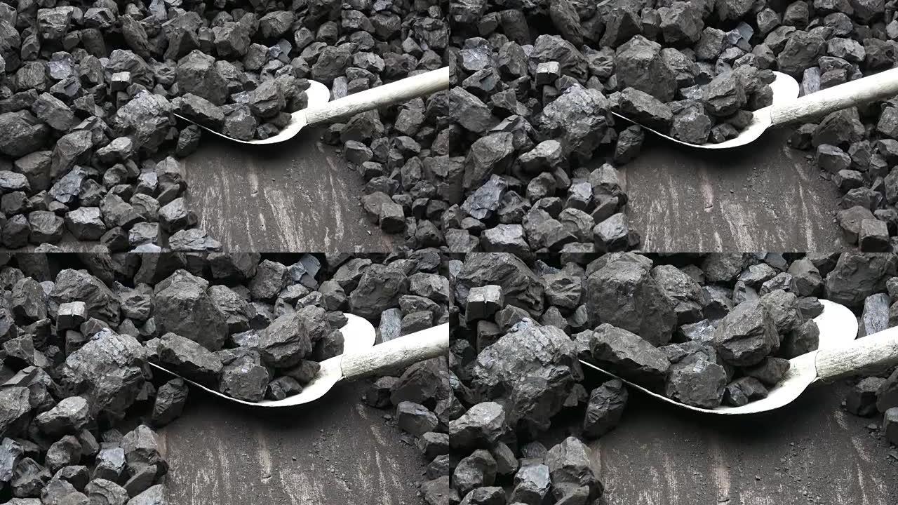 背景煤矿中的铲子和煤