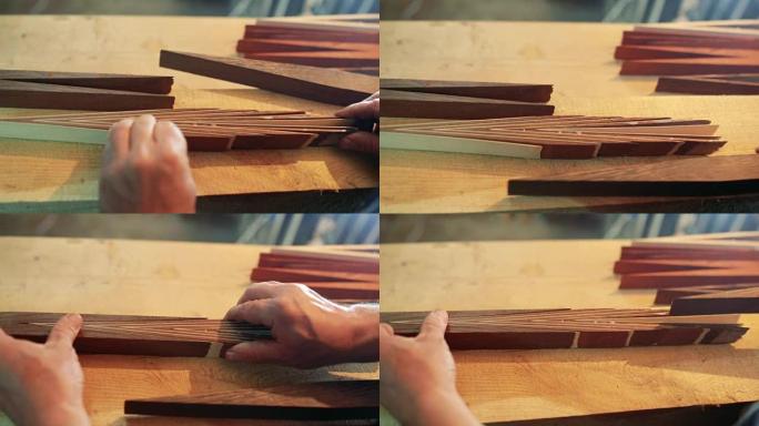 组装台球杆。薄木材