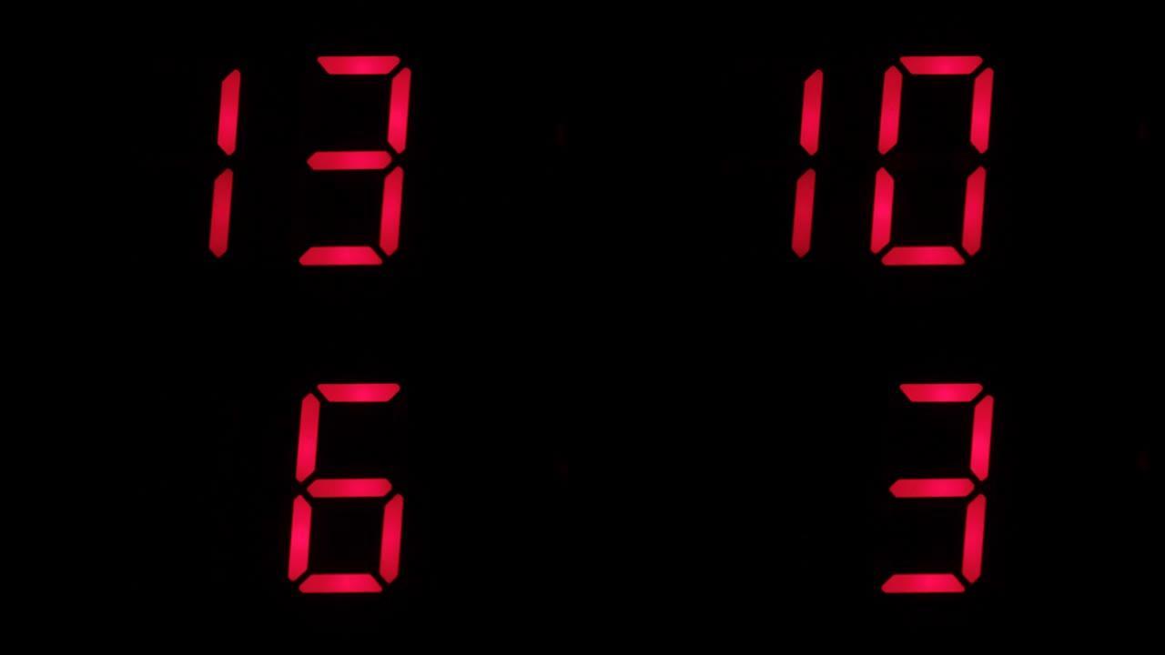 数字钟倒计时从十六到零。黑色背景上红色的数字定时器