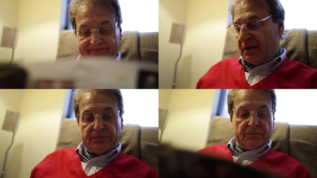 老人在客厅里阅读杂志的坦率时刻。退休男子阅读文章