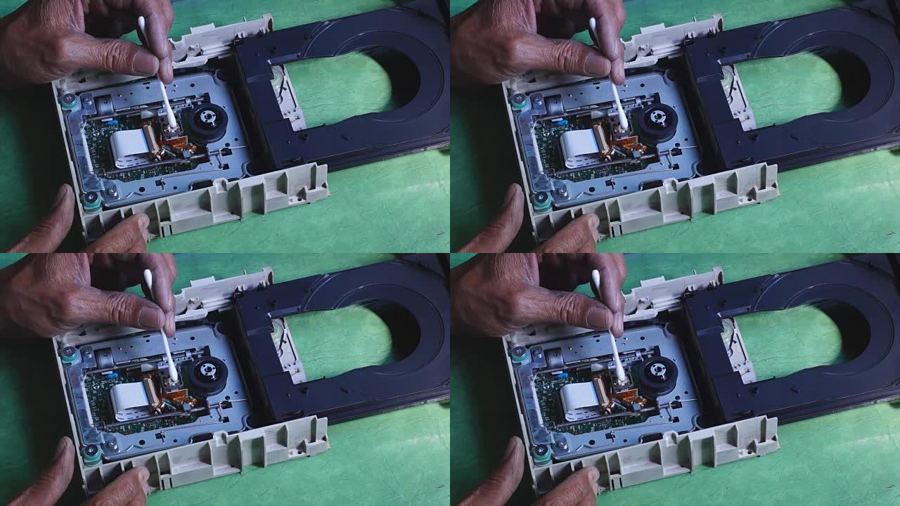 技术人员清洗DVD硬盘的激光头或光学镜头