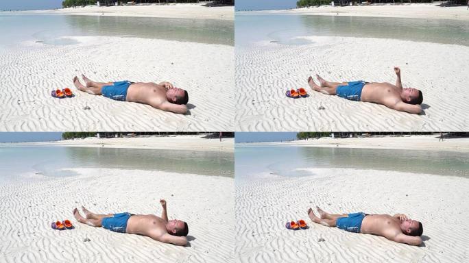 这个人躺在海边抽烟