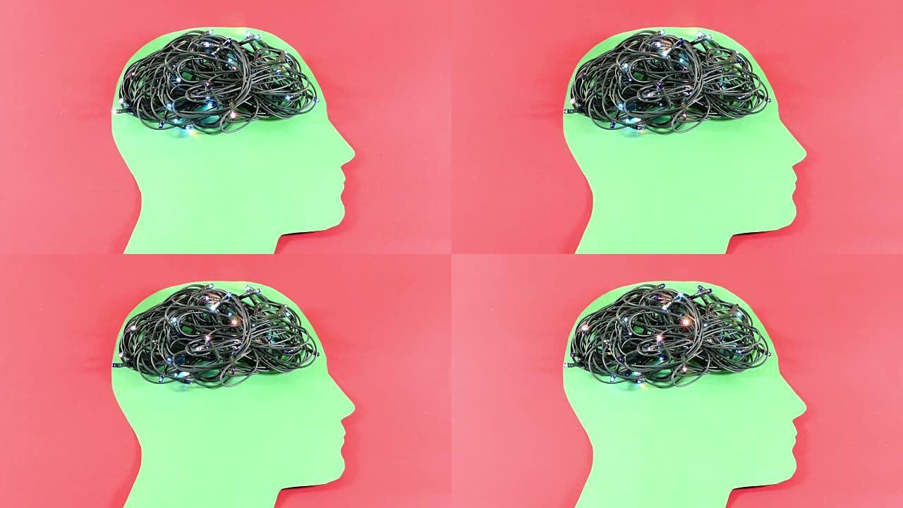 随机闪烁的灯光和缠绕的连接线放置在红色背景下的绿色男性头部轮廓上，概念性镜头