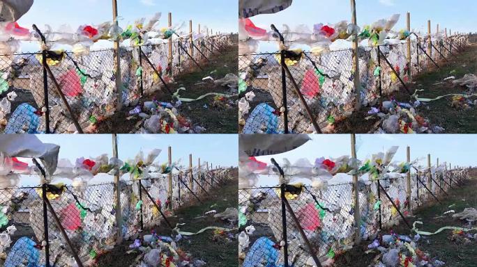 一堆塑料袋和其他精炼石油产品倾倒在垃圾填埋场。垃圾堆渗入地下水。需要进行废物分类