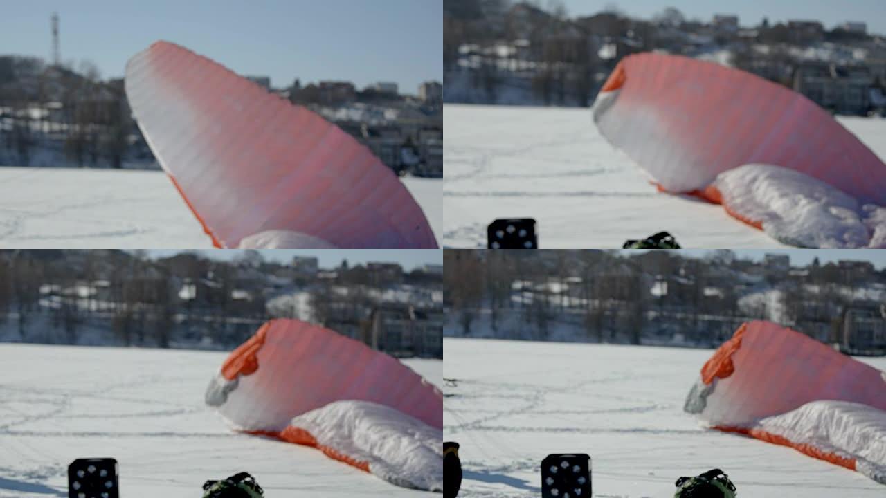滑翔伞比赛的准备。伞兵装备竞赛冰湖上的滑翔伞。滑翔伞着陆