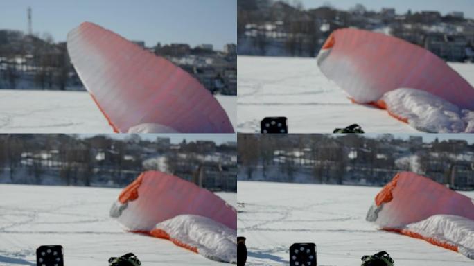滑翔伞比赛的准备。伞兵装备竞赛冰湖上的滑翔伞。滑翔伞着陆