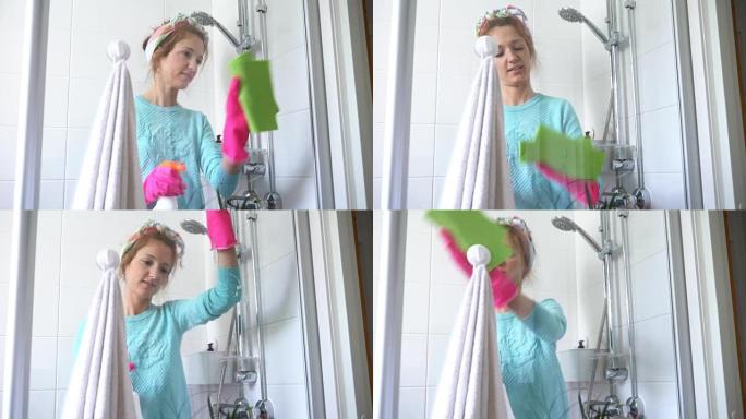 戴橡胶手套的女人打扫淋浴间