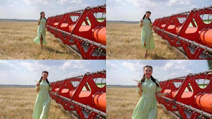 穿着裙子的可爱女孩在背景金色田野农业机械附近慢动作