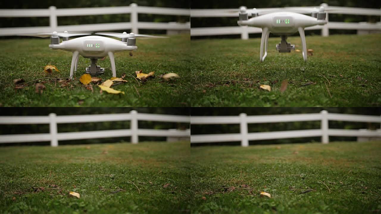 小型无人机以慢动作从草地上升空