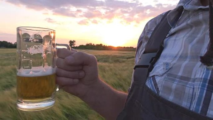 man with beer in field