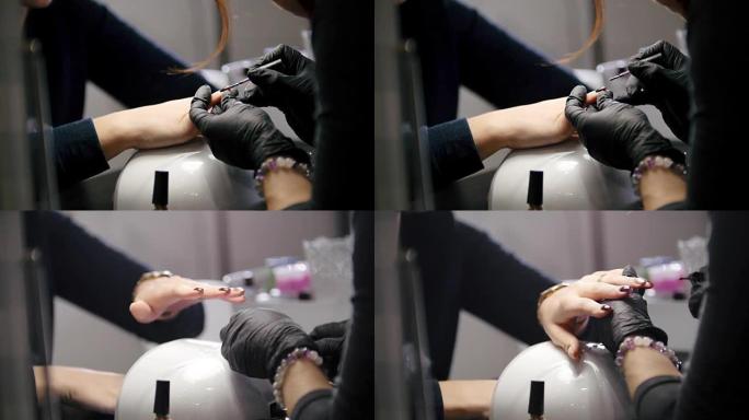 Macro view of nail polishing - female get professi