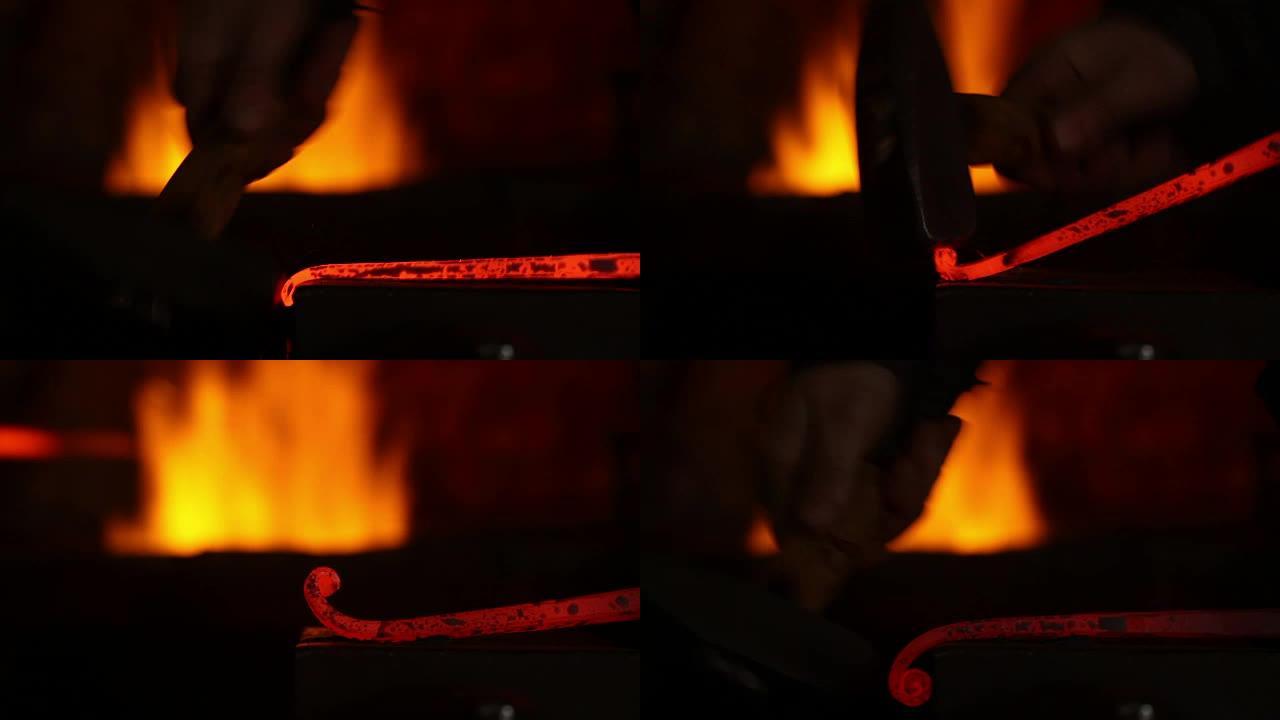 铁匠工作的艺术。铁匠大师在铁匠铺的铁砧上锻造红热铁。锻造，拧，砸铁。