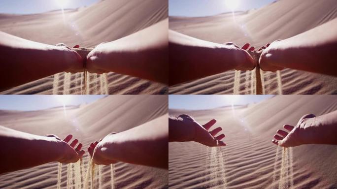 女孩在干旱环境中手握沙漠沙子