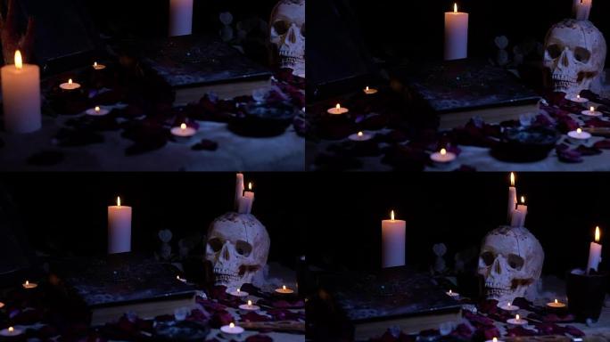 滑块拍摄一本魔法书和一个蜡烛中的头骨