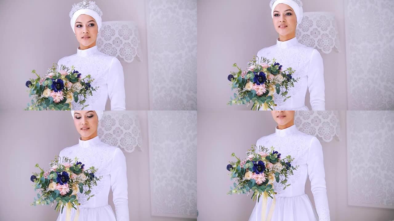 白色穆斯林婚纱和鲜花新娘头饰的美丽模特